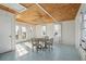 Bright room with wood ceiling, dining table and chairs, and natural light from waterfront view at 232 Haddrell St, Mount Pleasant, SC 29464