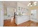 Open eat-in kitchen featuring white cabinets, modern appliances, and ample counter space at 232 Haddrell St, Mount Pleasant, SC 29464