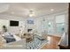 Virtually staged living room with a fireplace, hardwood floors, and modern decor at 232 Haddrell St, Mount Pleasant, SC 29464
