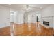 Open-concept living room features hardwood floors and a fireplace at 232 Haddrell St, Mount Pleasant, SC 29464