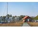 Waterfront shed at end of dock, with adjacent boat lift, offering stunning views and access at 232 Haddrell St, Mount Pleasant, SC 29464