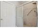 Close up of a shower stall with glass sliding doors and marble style tiling at 232 Haddrell St, Mount Pleasant, SC 29464