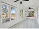 Bright sunroom with tile floor, many windows, and a ceiling fan for comfortable living at 232 Haddrell St, Mount Pleasant, SC 29464