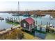 Charming waterfront home with a red roof, private dock, and stunning harbor views at 232 Haddrell St, Mount Pleasant, SC 29464