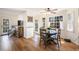 Bright dining area featuring hardwood floors, natural lighting, and a cozy breakfast table at 24 N Basilica Ave, Hanahan, SC 29410