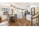 Eat-in kitchen featuring white cabinets, a center island with a tile accent, and natural lighting at 24 N Basilica Ave, Hanahan, SC 29410