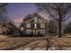 Charming two-story brick home with a balcony and mature trees on a neatly kept lawn at 24 N Basilica Ave, Hanahan, SC 29410