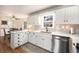 Kitchen with stainless steel appliances, white cabinets, quartz countertops and breakfast area at 24 N Basilica Ave, Hanahan, SC 29410