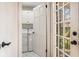 Light-filled laundry room equipped with modern appliances and ample cabinet space for convenience at 24 N Basilica Ave, Hanahan, SC 29410