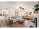 Cozy living room with hardwood floors, neutral decor, and a fireplace as a focal point at 24 N Basilica Ave, Hanahan, SC 29410