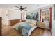 Main bedroom with a mural, windows, and dressers at 24 N Basilica Ave, Hanahan, SC 29410