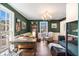 Inviting home office with dark green walls, hardwood floors, and lots of natural light at 24 N Basilica Ave, Hanahan, SC 29410
