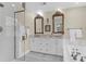 This elegant bathroom has double sinks, a large mirror, a shower, and a jacuzzi at 26 Beverly Rd, Charleston, SC 29407