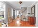 A bright and welcoming foyer features beautiful hardwood floors and plenty of natural light at 26 Beverly Rd, Charleston, SC 29407