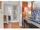 Inviting hallway featuring hardwood floors, antique furniture, and stylish decor at 26 Beverly Rd, Charleston, SC 29407