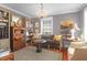 Cozy living room featuring a decorative chandelier, hardwood floors, and refined furnishings at 26 Beverly Rd, Charleston, SC 29407