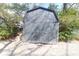 A backyard shed with a double door offers extra storage and convenience at 26 Beverly Rd, Charleston, SC 29407