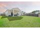 Grassy back yard with covered patio, perfect for enjoying the outdoors at 269 Firewheel Ct, Summerville, SC 29486