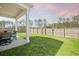 Back yard with green lawn, great for entertaining with covered porch at 269 Firewheel Ct, Summerville, SC 29486
