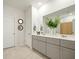 Bathroom featuring dual sinks, grey cabinets, a large mirror and tiled floors at 269 Firewheel Ct, Summerville, SC 29486