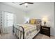 Cozy bedroom featuring a striped bedspread, decorative pillows, and natural light from the window at 269 Firewheel Ct, Summerville, SC 29486