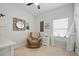 Cozy bedroom with a comfortable chair, writing desk and a wall mirror at 269 Firewheel Ct, Summerville, SC 29486