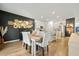 Dining room and kitchen with stainless appliances, granite counters, seating, and light gray cabinetry at 269 Firewheel Ct, Summerville, SC 29486