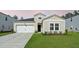 Charming single-Gathering home featuring a well-manicured lawn and an attached two-car garage at 269 Firewheel Ct, Summerville, SC 29486
