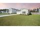 Charming single-Gathering home featuring a well-manicured lawn and an attached two-car garage at 269 Firewheel Ct, Summerville, SC 29486