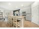 Kitchen island with barstool seating, stainless appliances, and light grey cabinetry at 269 Firewheel Ct, Summerville, SC 29486