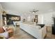 Open-concept living room with light gray sofa, modern decor, and seamless flow to the dining and kitchen areas at 269 Firewheel Ct, Summerville, SC 29486