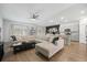 Open-concept living room features a large sectional sofa, wood floors, and access to the kitchen at 269 Firewheel Ct, Summerville, SC 29486