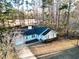 An aerial view of a light blue home with a dark roof, expansive yard and mature trees at 2929 Salamander Creek Ln, North Charleston, SC 29406