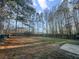 Spacious backyard featuring green grass and a built-in fire pit at 2929 Salamander Creek Ln, North Charleston, SC 29406