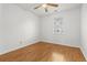 A bedroom with wood floors, a ceiling fan, and a window for natural light at 2929 Salamander Creek Ln, North Charleston, SC 29406