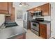 Updated kitchen with stainless steel appliances, ample countertop space, and stylish lighting at 2929 Salamander Creek Ln, North Charleston, SC 29406
