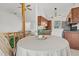 The kitchen area with wood cabinets is open to the dining area and seating on the other side of a half wall at 2929 Salamander Creek Ln, North Charleston, SC 29406