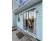 Exterior of home featuring sliding glass door and light blue siding at 2929 Salamander Creek Ln, North Charleston, SC 29406
