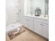 Modern bathroom featuring double sinks, white cabinets, and a step-in shower at 310 Pine Crest View Dr, Summerville, SC 29486