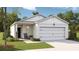Charming single-story home with a two-car garage, white siding, and a welcoming front porch at 310 Pine Crest View Dr, Summerville, SC 29486