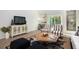 Inviting living room with hardwood floors, stylish furniture, and a view of the outdoors at 310 Pine Crest View Dr, Summerville, SC 29486