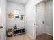 Practical mudroom with storage bench, hooks, and a window for natural light at 310 Pine Crest View Dr, Summerville, SC 29486