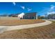 View of a backyard, with a patio set, grass, and a view of the house with a gray siding at 317 Catawba Branch Way, Moncks Corner, SC 29461