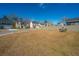 Spacious backyard with room for lawn games and seating, surrounded by fences and neighboring homes at 317 Catawba Branch Way, Moncks Corner, SC 29461