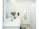 Bright bathroom featuring double sinks, a large mirror, and a shower with polka-dot curtain at 317 Catawba Branch Way, Moncks Corner, SC 29461