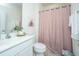 Well-lit bathroom with a neutral color scheme, vanity, and a bathtub at 317 Catawba Branch Way, Moncks Corner, SC 29461