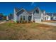 Well-maintained two-story home showcasing attractive siding and a neatly kept lawn in a friendly neighborhood at 317 Catawba Branch Way, Moncks Corner, SC 29461