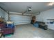 Cluttered garage with white walls, an automatic door, and room for parking and storage at 317 Catawba Branch Way, Moncks Corner, SC 29461
