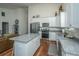 Contemporary kitchen with ample white cabinets, stainless appliances, and granite island at 317 Catawba Branch Way, Moncks Corner, SC 29461