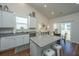 Bright eat-in kitchen features granite counters, stainless appliances, and access to backyard patio at 317 Catawba Branch Way, Moncks Corner, SC 29461
